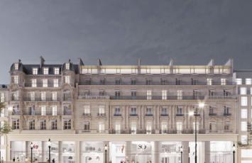 Vue à la tombée de la nuit du 150 avenue des Champs Elysées : un cinéma MK2 prend place à côté de l'hôtel SO Sofitel.